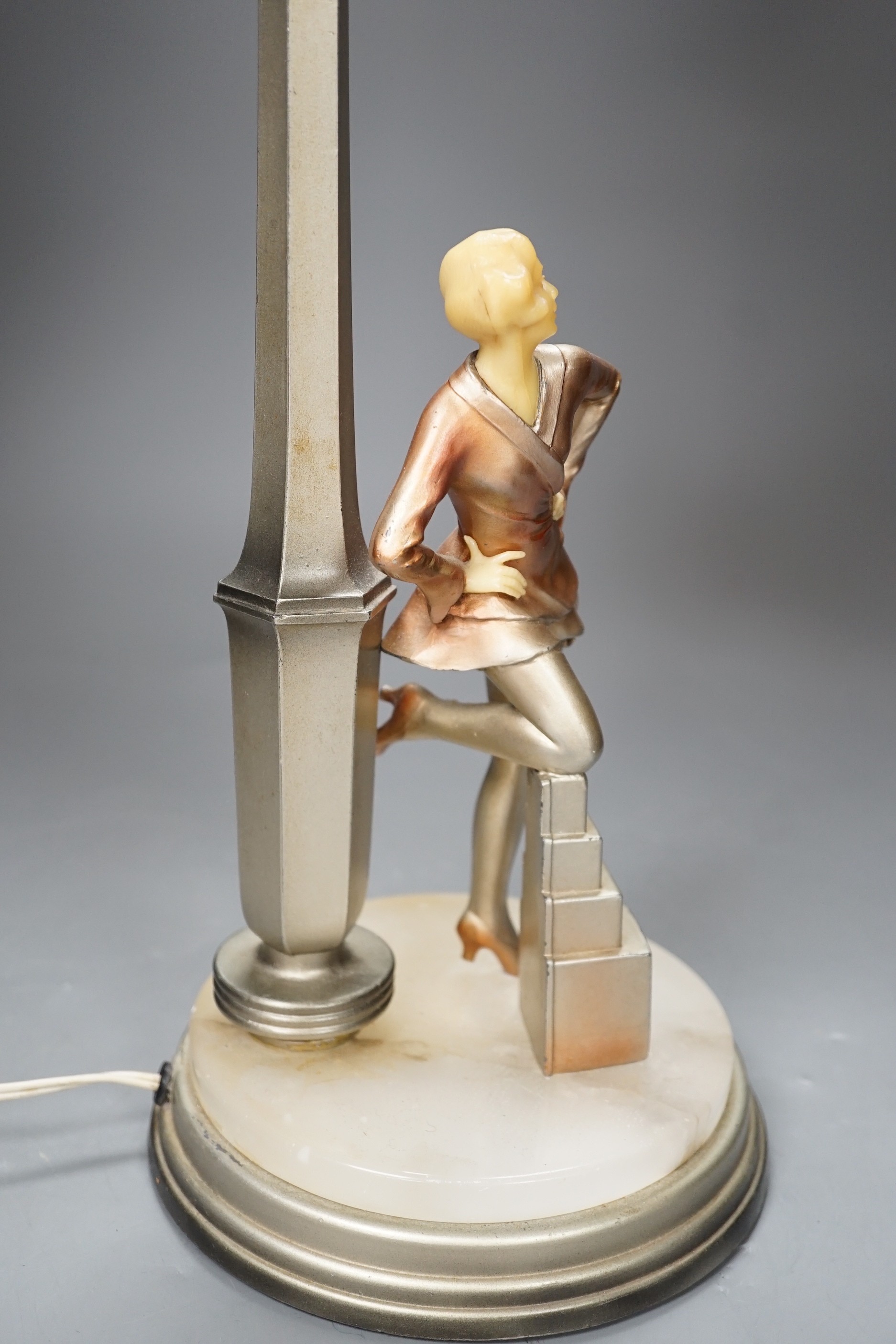 An Art Deco Cold painted spelter and composition figural table lamp and glass shade, 67cm high